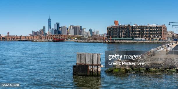 red hook and lower manhattan view from a ferry - red hook fotografías e imágenes de stock