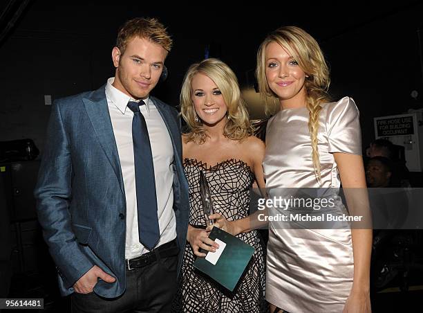 Actor Kellan Lutz, singer Carrie Underwood and actress Katie Cassidy backstage during the People's Choice Awards 2010 held at Nokia Theatre L.A. Live...