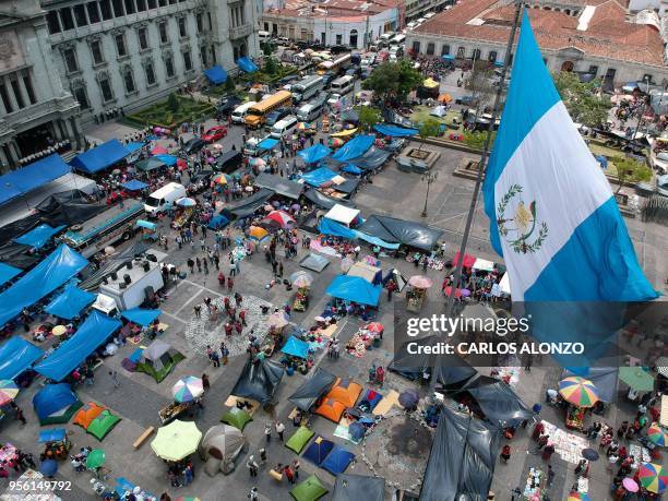 Aerial view of the Constitution square and the National Palace, in Guatemala City, on May 08, 2018 where Guatemalan teachers are camping, as part of...