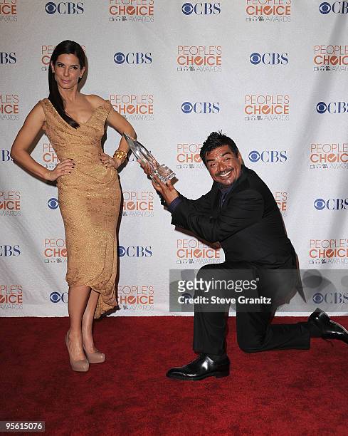 Actor/ Comedian George Lopez and Actress Sandra Bullock pose in the press room at the People's Choice Awards 2010 held at Nokia Theatre L.A. Live on...