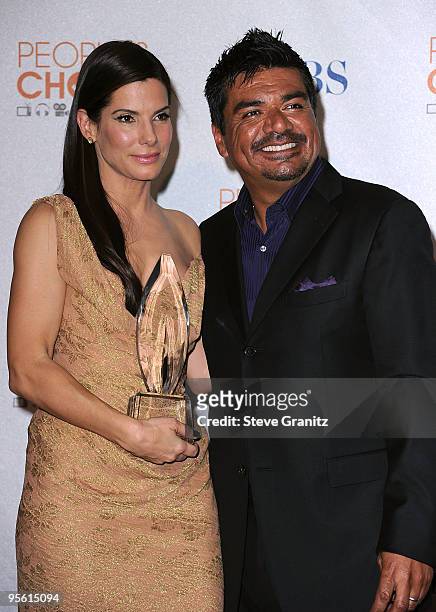 Actor/ Comedian George Lopez and Actress Sandra Bullock pose in the press room at the People's Choice Awards 2010 held at Nokia Theatre L.A. Live on...