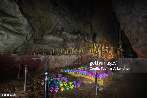 inside the pak ou caves in laos - pak ou caves stock pictures, royalty-free photos & images