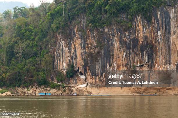 pak ou caves in laos - pak ou caves stock pictures, royalty-free photos & images