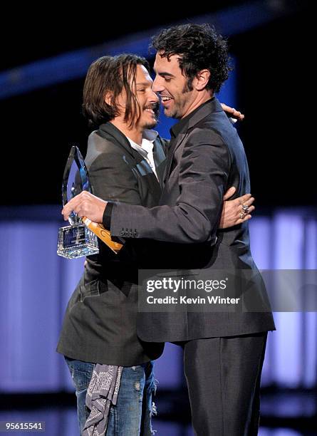 Actor Sacha Baron Cohen presents actor Johnny Depp the award for Favorite Movie Actor onstage during the People's Choice Awards 2010 held at Nokia...