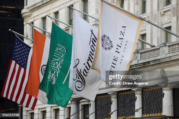 The flag of Saudi Arabia hangs alongside flags for the Plaza Hotel at the entrance to the Plaza Hotel in Midtown Manhattan, May 8, 2018 in New York...