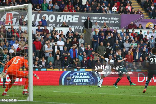Andre Ayew of Swansea City watches as his shot narrowly misses the crossbar during the Premier League match between Swansea City and Southampton at...