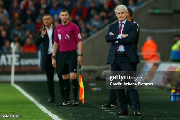 Southampton manager Mark Hughes watches on with Swansea City manager Carlos Carvalhal during the Premier League match between Swansea City and...