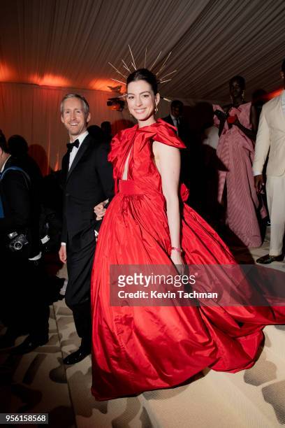 Adam Shulman and Anne Hathaway attend the Heavenly Bodies: Fashion & The Catholic Imagination Costume Institute Gala at The Metropolitan Museum of...