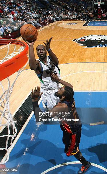 Al Jefferson of the Minnesota Timberwolves shoots over Ronny Turiaf of the Golden State Warriors during the game on January 6, 2010 at the Target...