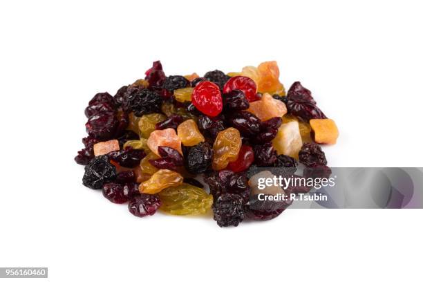 mix variety of dried fruit over white background - fruchtzucker stock-fotos und bilder