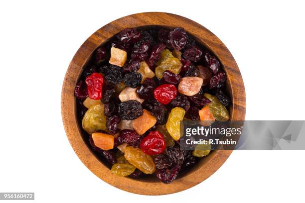 mix variety of dried fruit in wooden bowl over white background - fructose stock pictures, royalty-free photos & images