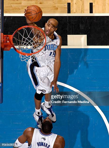 Vince Carter of the Orlando Magic takes the ball to the basket against the Toronto Raptors during the game on January 6, 2010 at Amway Arena in...