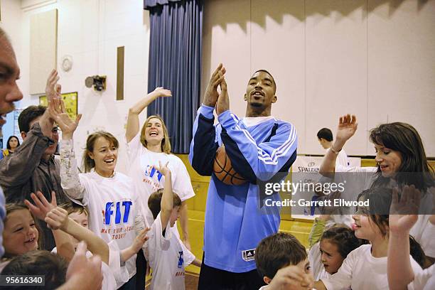 Smith of the Denver Nuggets leads students in a cheer at West Middle School as part of the Nuggets Team Fit and NBA Fit Week Programs on January 6,...