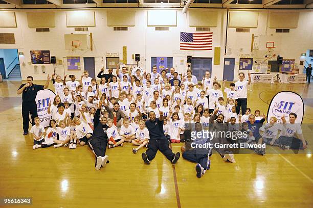 Students pose for a photo with members of the Denver Nuggets at West Middle School as part of the Nuggets Team Fit and NBA Fit Week Programs on...