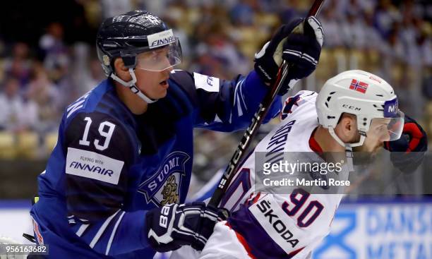 Veli Matti Savinainen of Finland and Daniel Sorvik of Norway battle for position during the 2018 IIHF Ice Hockey World Championship group stage game...