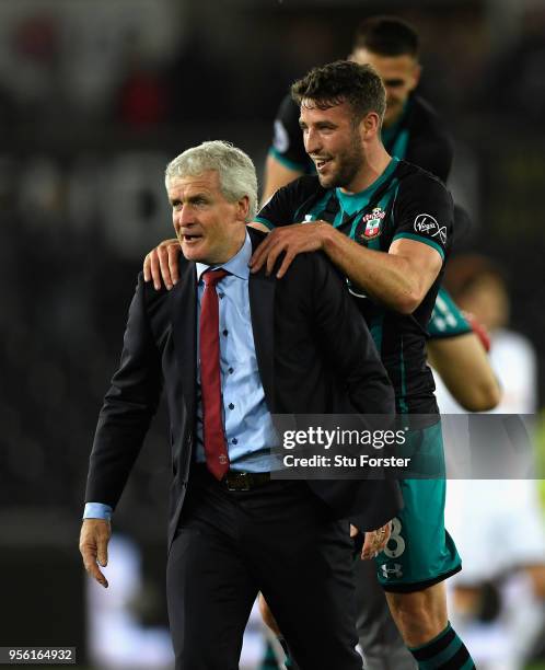 Sam McQueen of Southampton celebrates with Mark Hughes, Manager of Southampton during the Premier League match between Swansea City and Southampton...