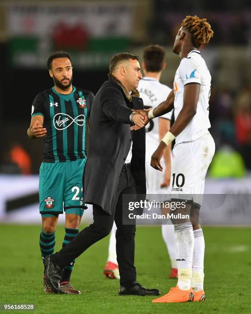 Carlos Carvalhal and Tammy Abraham of Swansea City shake hands during the Premier League match between Swansea City and Southampton at Liberty...