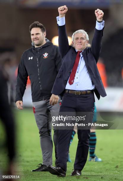 Southampton manager Mark Hughes celebrates victory after the Premier League match at the Liberty Stadium, Swansea.