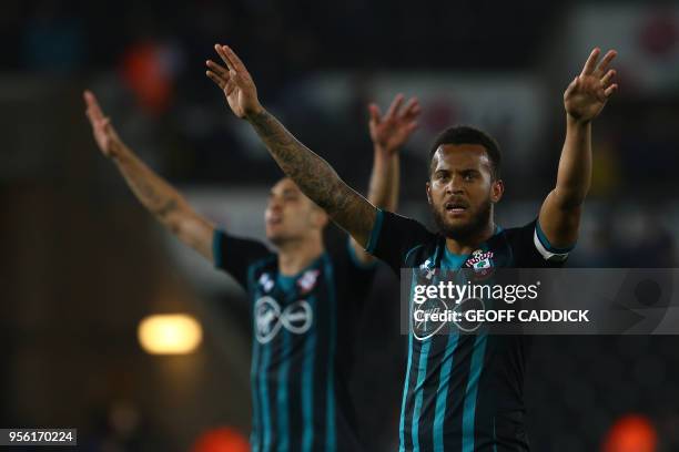 Southampton's Spanish midfielder Oriol Romeu and Southampton's English defender Ryan Bertrand applauds the fans following react following the English...