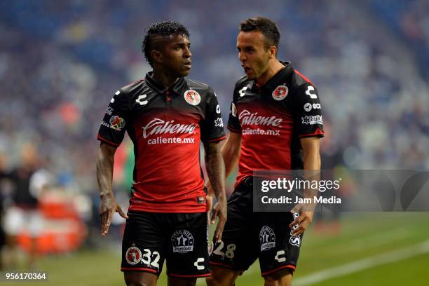 Miler Bolanos of Tijuana celebrates with teammate Omar Mendoza after scoring the first goal of his team during the quarter finals second leg match...