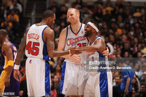 Rasual Butler, Chris Kaman, and Baron Davis of the Los Angeles Clippers share a laugh during a game against the Los Angeles Lakers at Staples Center...