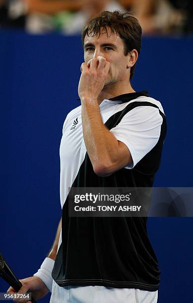 Tommy Robredo of Spain reacts to a line call against Lleyton Hewitt of Australia during their singles match on the ninth session, day six of the...