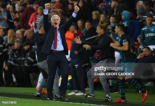 Southampton Welsh manager Mark Hughes reacts following the English Premier League football match between Swansea City and Southampton at The Liberty...