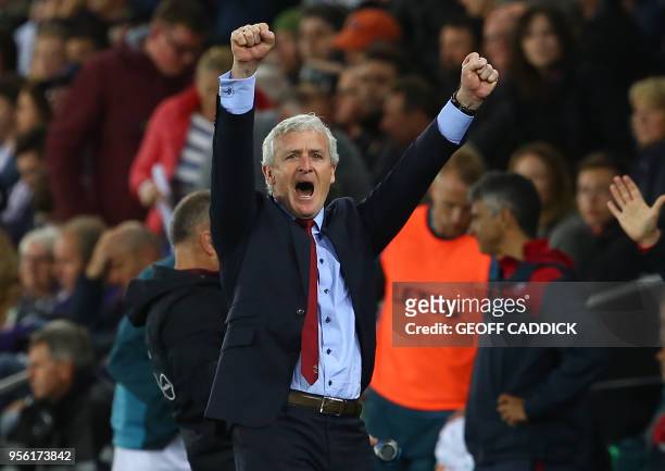 Southampton Welsh manager Mark Hughes reacts following the English Premier League football match between Swansea City and Southampton at The Liberty...