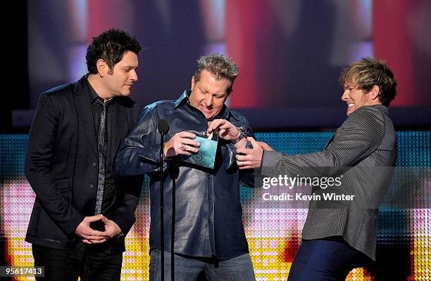 Musicians Jay DeMarcus, Gary LeVox and Joe Don Rooney of the band Rascal Flatts speak onstage during the People's Choice Awards 2010 held at Nokia...