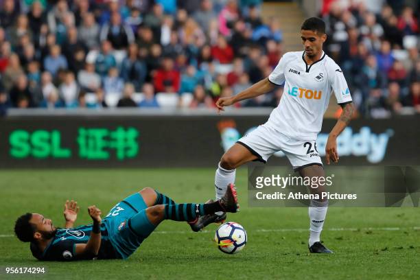 Kyle Naughton of Swansea City challenged by Ryan Bertrand of Southampton during the Premier League match between Swansea City and Southampton at The...