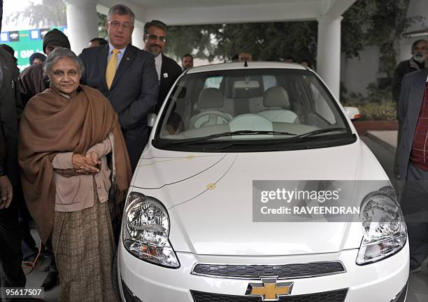 Delhi Chief Minister Sheila Dixit , President and Managing Director 0f General Motors India, Karl Slym and Deputy Chairman of REVA Electric car...