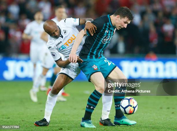 Andre Ayew of Swansea City challenges Pierre-Emile Hojbjerg of Southampton during the Premier League match between Swansea City and Southampton at...