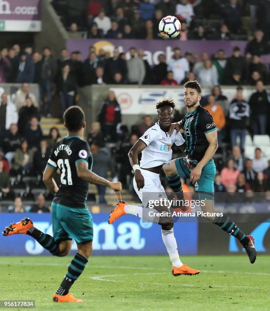 Wesley Hoedt of Southampton heads the ball away from Tammy Abraham of Swansea City during the Premier League match between Swansea City and...