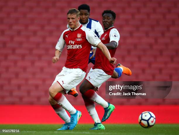Danny Ballard and Tolaji Bola of Arsenal U/23 compete for the ball against Musa Yahaya of Porto U23 during the Premier League International Trophy...