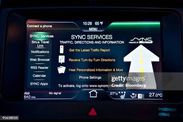 The Ford MyTouch Microsoft Sync services page is displayed on a mock interior at the 2010 International Consumer Electronics Show in Las Vegas,...