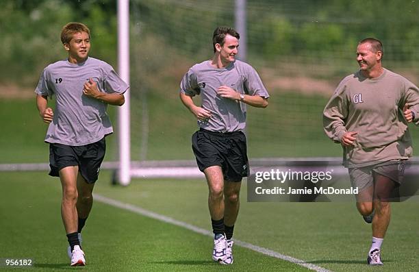 Junichi Inamoto and Francis Jeffers of Arsenal go on a gentle jog during an Arsenal training session held in Colney, England. \ Mandatory Credit:...