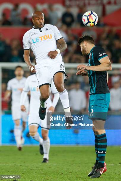 Andre Ayew of Swansea City contends with Wesley Hoedt of Southampton during the Premier League match between Swansea City and Southampton at Liberty...