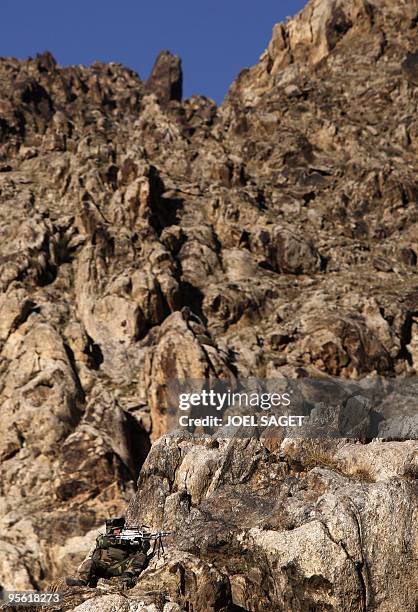 French soldier of the 13 éme BCA provides cover during disengagement from Jalokhel in Kapisa province on January 5, 2010. About 113,000 US and allied...