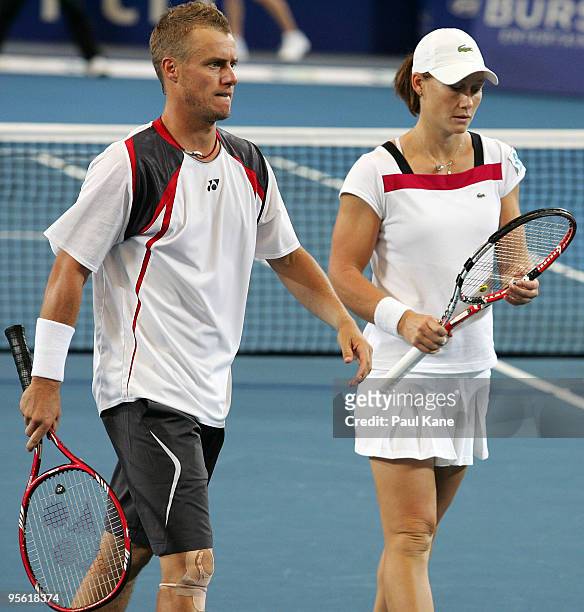 Lleyton Hewitt and Samantha Stosur of Australia look on in their mixed doubles match against Tommy Robredo and Maria Jose Martinez Sanchez of Spain...
