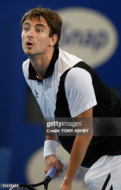 Tommy Robredo of Spain reacts while playing against Lleyton Hewitt of Australia during their men's singles match on the ninth session of day six at...