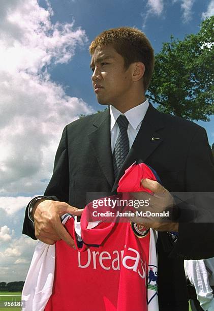 New Arsenal signing Japenese star Junichi Inamoto poses for the cameras during a press conference held in Colney, England. \ Mandatory Credit: Jamie...