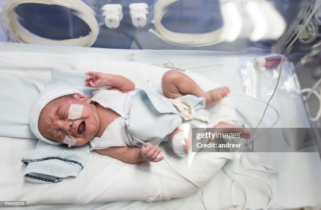 Sweet premature baby in the NICU with oxygen crying