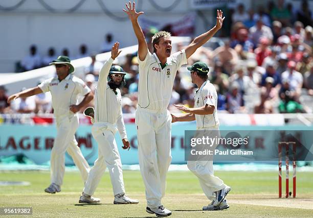 Paul Harris of South Africa celebrates taking the wicket of James Anderson of England after he was caught out by Ashwell Prince for 9 runs during day...