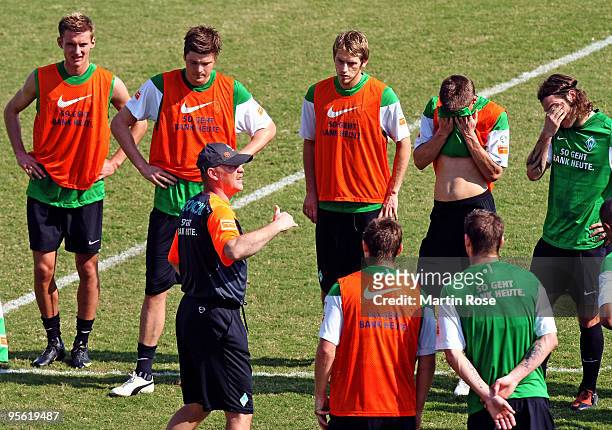 Thomas Schaaf ,head coach of Bremen speaks to the team during the Werder Bremen training session at the Al Wasl training ground on January 7, 2010 in...