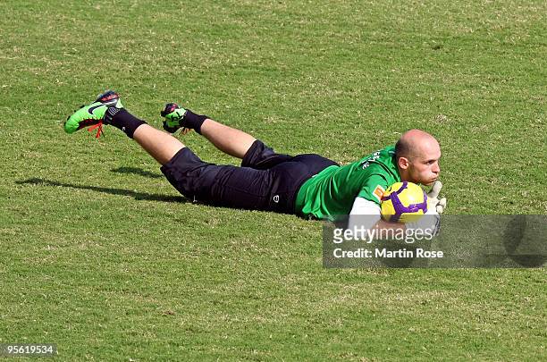 Christian Vander, goalkeeper of Bremen saves the ball during the Werder Bremen training session at the Al Wasl training ground on January 7, 2010 in...