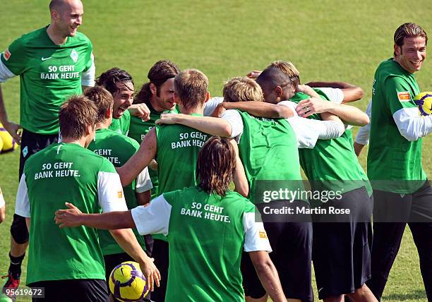 The team of Bremen celebrate during the Werder Bremen training session at the Al Wasl training ground on January 7, 2010 in Dubai, United Arab...
