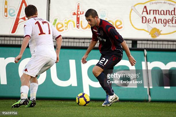 Michele Canini of Cagliari and Riise John Arne of Roma during the Serie A match between Cagliari and Roma at Stadio Sant'Elia on January 6, 2010 in...