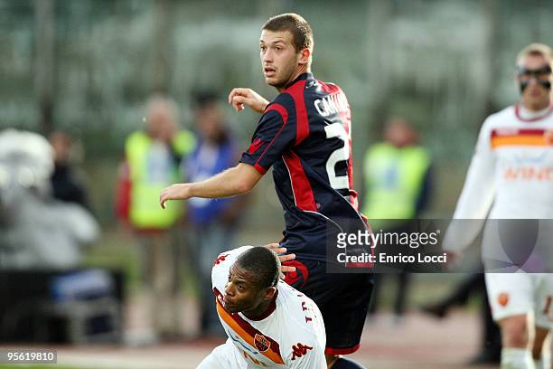 Michele Canini of Cagliari and Baptista Julio Cesar of Roma during the Serie A match between Cagliari and Roma at Stadio Sant'Elia on January 6, 2010...
