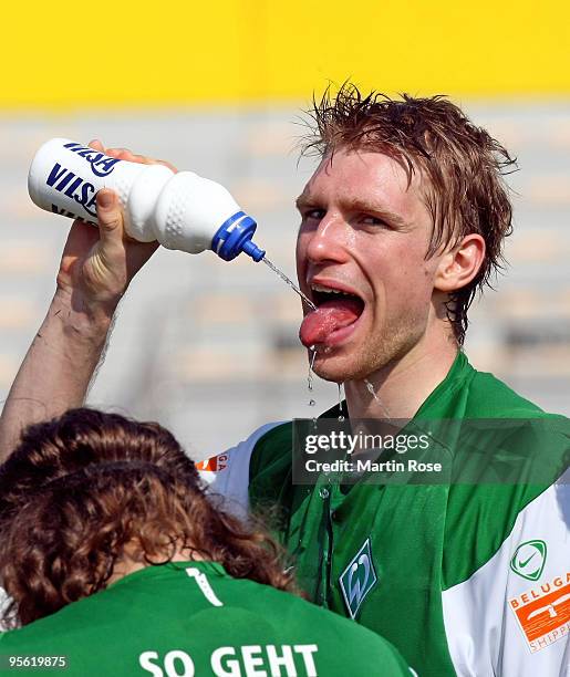 Per Mertesacker of Bremen takes a break during the Werder Bremen training session at the Al Wasl training ground on January 7, 2010 in Dubai, United...