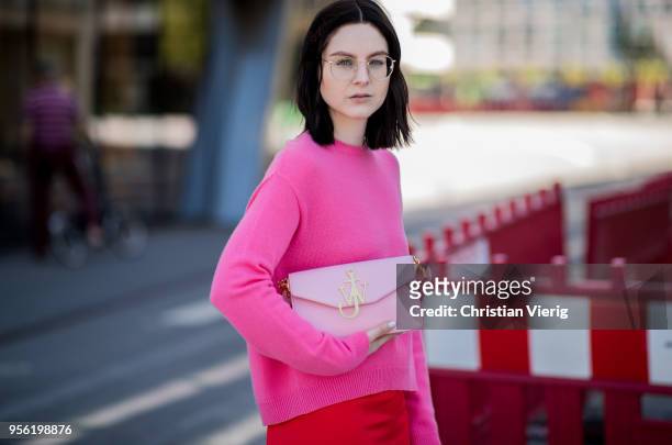 Maria Barteczko wearing pink cashmere sweater Valentino, red silk asymmetric midi skirt Victoria Beckham, light pink bag JW Anderson, light pink...